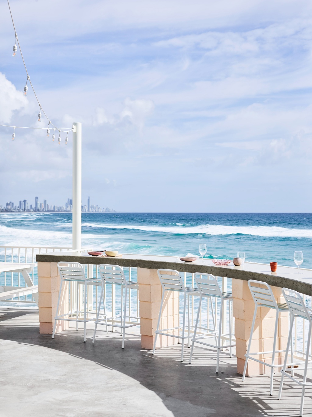 Burleigh Pavilion Outdoor Bar Seating and Beach.